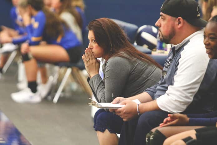 Coach Nikki LaRiviere watches her players’ performance during the fifth set against Crystal River Tuesday night.