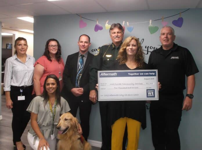 Front: Melanie Rivera, Hernando County Sheriff's Office (HCSO), Turbo; Back Left to Right: Representing HCSO - Kathy Chipelo, Kelly Kamin, Lt. William Power, Sheriff Al Nienhuis, CAC Director Janine Kell, Rodney Tower (Aftermath)