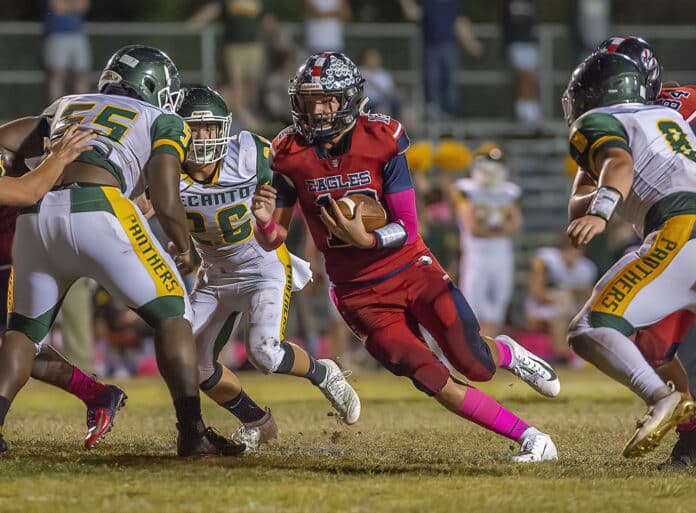 Springstead High’s QB ,12, Max O’Rourke exploits a gap in Lecanto’s defense Friday night at Booster Stadium. Photo by JOE DiCRISTOFALO