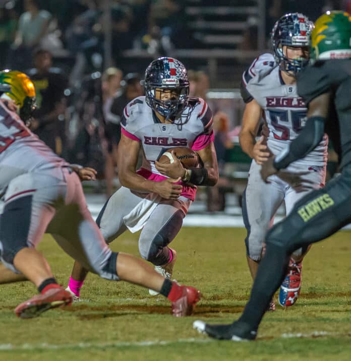  Springstead running back ,4, Anthony Alexis, looks for some running room Friday night at Lake Minneola High. Photo by Joe DiCristofalo