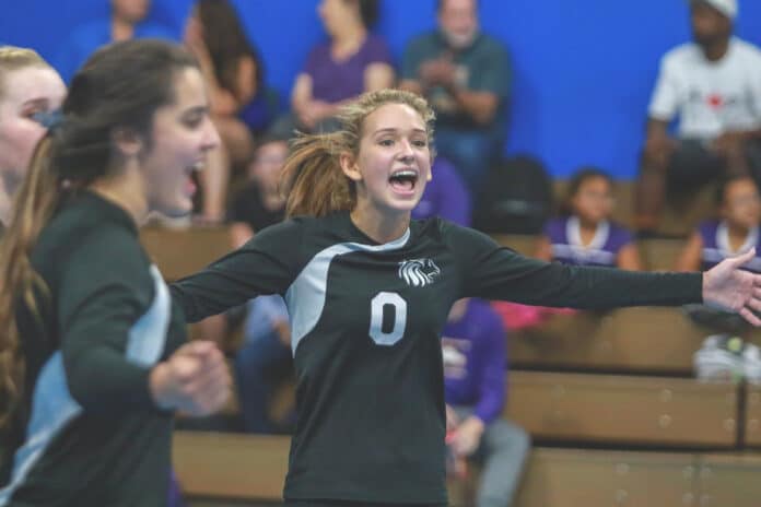 (FILE PHOTO)Lions Senior Abigail Jackson celebrates a point gained with her teammates. 