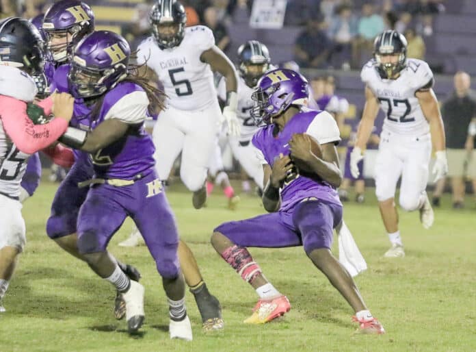 Leopards’ Quarterback Maurice Holland attempts to find an opening created by his defense line during the game against Hernando High last week.