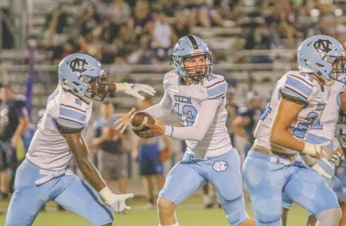 Sharks’ Vaughn Sykora attempts a fake handoff to Kyle Mcintosh. File photo by Alice Mary Herden