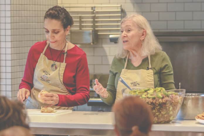 Founder Maria Scunziano-Singh M.D. and Wellness Coordinator Diane Friedberg demonstrates healthy cooking habitats during the WellCome OM official campus grand opening celebration held on Saturday, October 5