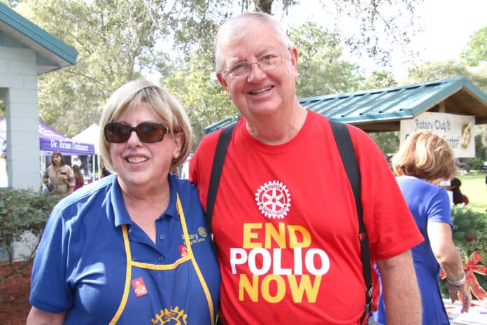 Photo of Rotarian, Carol Sitroon organizer of Barktober Fest: Paws for Polio and District Governor and feature speaker, Allen R. Collins, a polio survivor