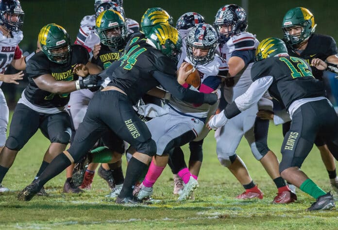 Springstead quarterback, Max O’Rourke, gains tough yardage against the Minneola defense. Photo by Joe DiCristofalo 