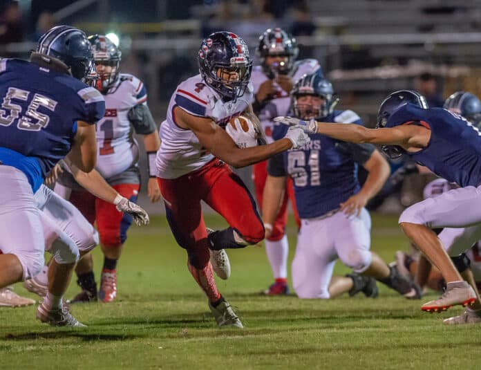 Springstead, 4, Anthony Alexis, rushes through the Central defense Friday night during the 56-0 win by the visiting Eagles at the Bear Den. Photo by JOE DiCRISTOFALO