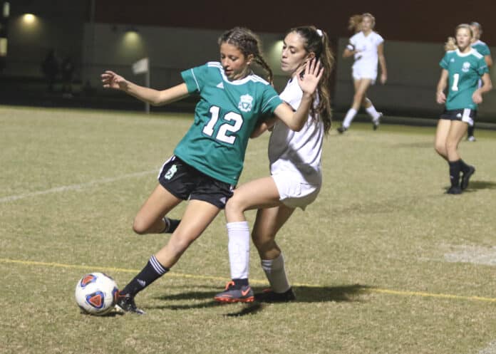 Leopard’s Gianna Huber (8) and Hornets Giavanna Seaman (12) on the field during a non-conference game against Hernando High School Wednesday night at Weeki Wachee High School. 