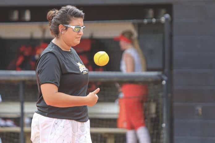 Asst. softball coach Jeri Loffler crosses the field during the doubleheader fall scrimmage game against the Predators