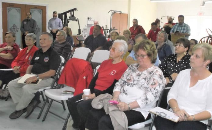 Attendees listen to veterans speak about their experiences with PTSD