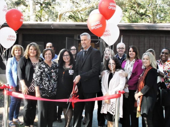 Superintendent John Stratton performs the ribbon cutting