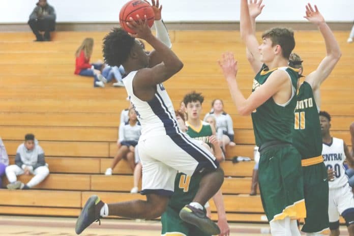 Central’s Contae Cason (4) attempts a layup for two points during the match against Lecanto Tuesday night at Central High School.