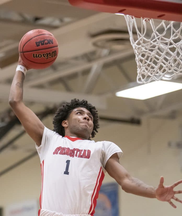 Springstead High,1, Unique Torain, skies for a dunk against Gulf High Thursday at Springstead. Photo by JOE DiCRISTOFALO