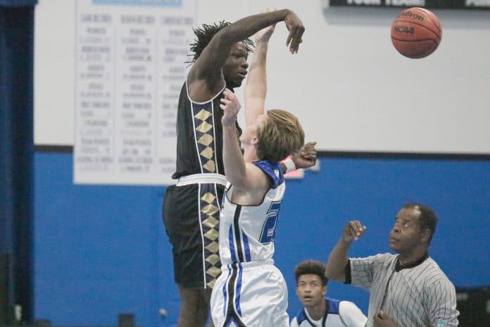 Dec 5th game begins with a tip-off between #21 of Tampa Bay Christian Academy and Riley Decker from Hernando Christian Academy. 