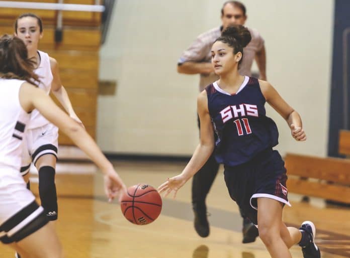 Springstead Senior Brooklyn Glines dribbles down court during the Hoops for Hope tournament at River Ridge High School in New Port Richey.