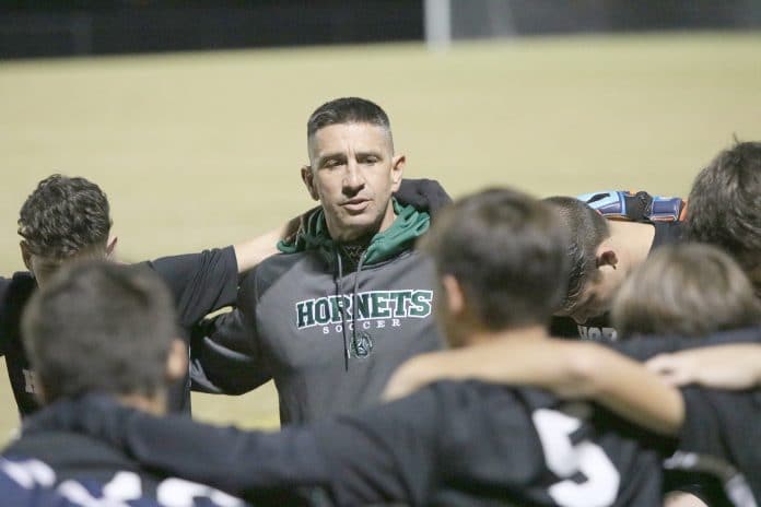 Coach Shane Tarbox gives final preparations to the Weeki Wachee Hornets minutes before Friday nights home game against Nature Coast Tech.