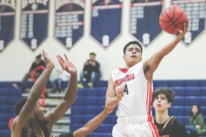 Felix Gamboa (14), Springstead Junior, attempts a layup against Brooks DeBartolo during the 5th Annual Greg O’Connell New Years Shootout at Springstead High School.