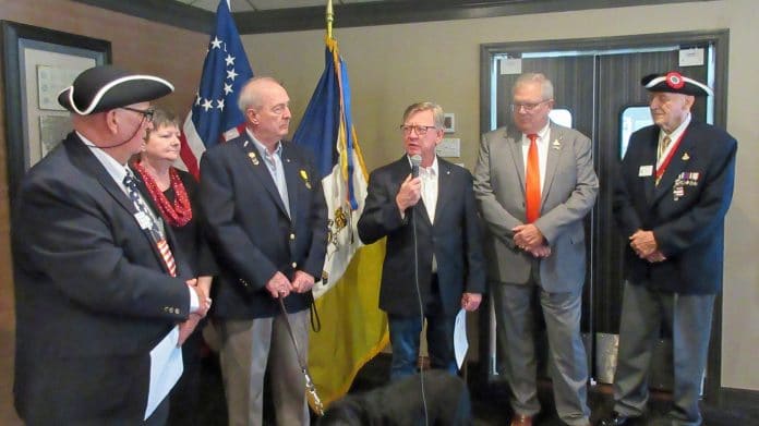 Tom Barnette, center, is inducted into the Sons of the American Revolution