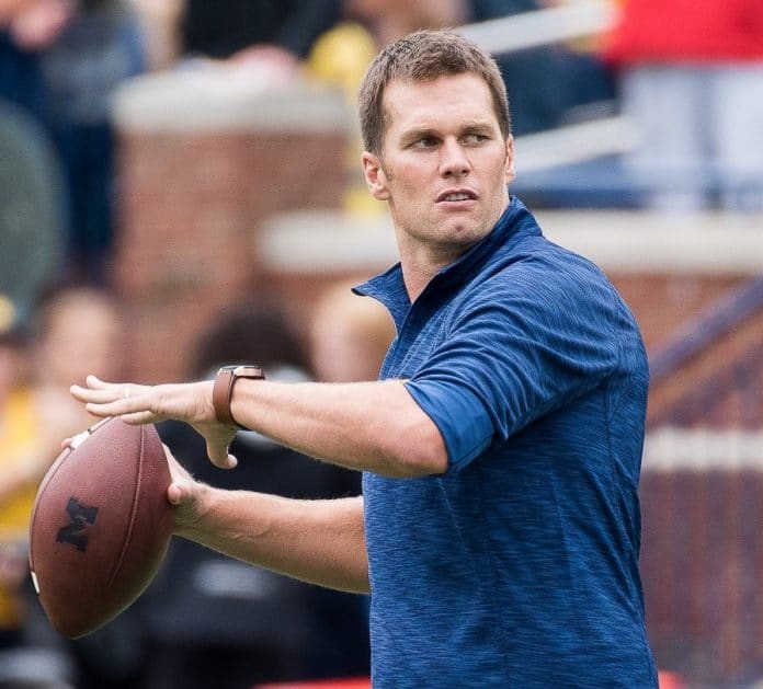 Tom Brady throwing to Jim Harbaugh before w:2016 Michigan Wolverines football team's 45-28 victory over w:2016 Colorado Buffaloes football team at w:Michigan Stadium on September 17, 2016. Date	17 September 2016, 13:44:22 Source	https://www.flickr.com/photos/maizenbluenation/29670423041/ Author	Brad Muckenthaler