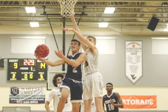 Sophomore Tre Joyner (2), Central’s shooting guard, performs a layout as The Villages Charter Samuel Walters (15) attempts to block.