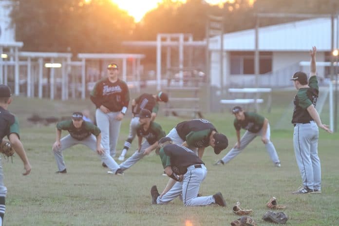 Weeki Wachee baseball players warm-up before playing Fivay on Thursday night at Central High School.