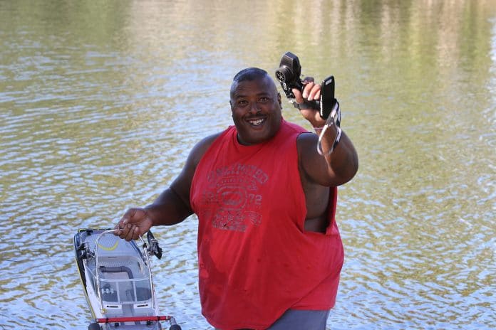 Earl Arthur off the bank holding the RC Rescue Boat. 