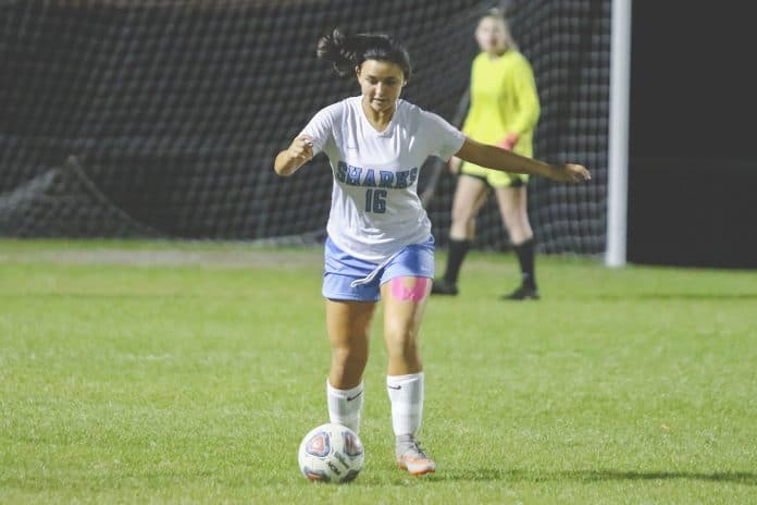 Sharks MacKenzie Bell plays the ball to begin the regional quarterfinals on Feb. 11, 2020 against Weeki Wachee.