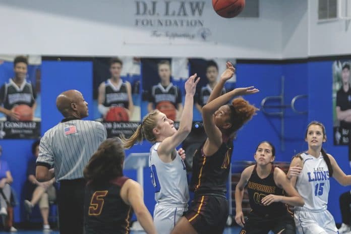 Hernando Christian Academy hosts 2A Girls Basketball State Championships Regional quarter-finals on Thursday, February 13. HCA’s  Cassidy Coffman (20) and Bayshore’s Sierra Bell (11) begin the game. 