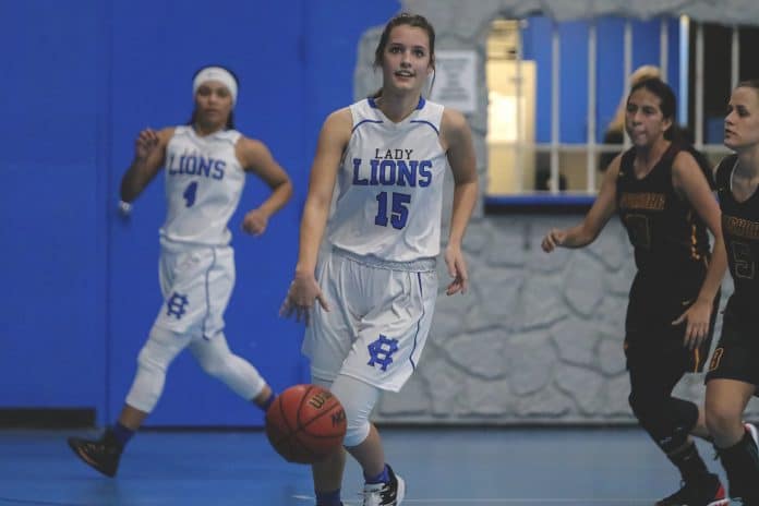 Lions Esther Jackson looks up at the last seconds of the clock as the game ends. Hernando Christian Academy wins the Regional quarter-finals against Bayshore Christian Academy, 36-32.