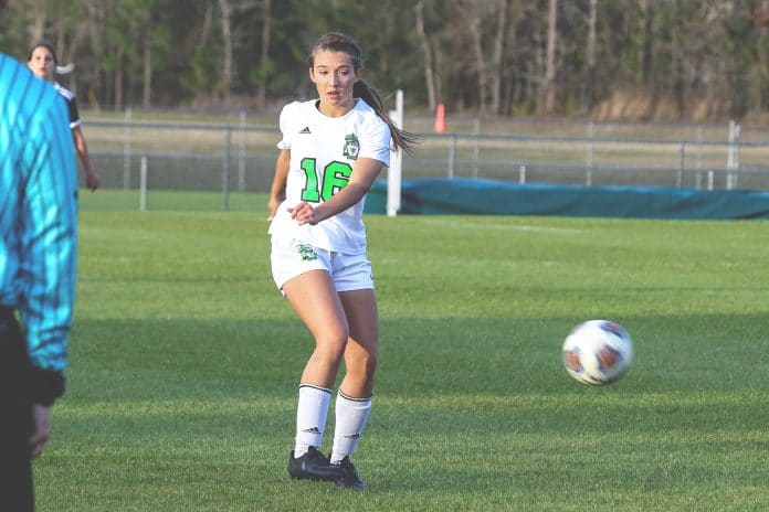 Hornets’ Hayley Crews passes the ball to her teammate during the 4A District 5 Tournament held on Friday, Feb. 7, 2020 at Weeki Wachee High School.