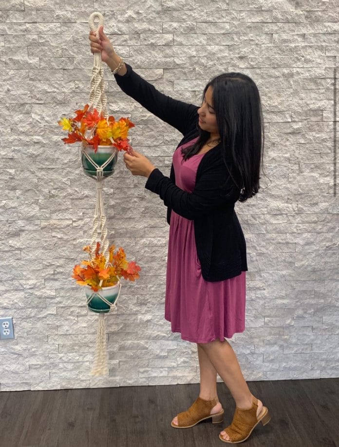 Patricia Walters shows her macrame work