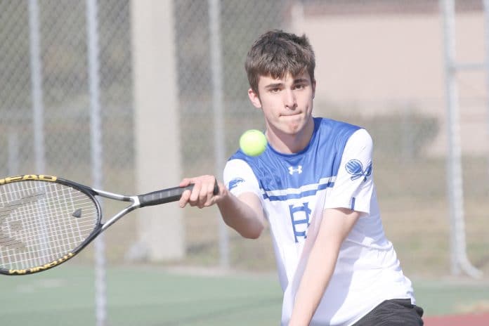 HCA Jacob Dedman prepares to send the ball to NCT opponent Logan Callori during the Feb 10th tennis match at McKethan Park Brooksville.  Photo by Betty Kolar