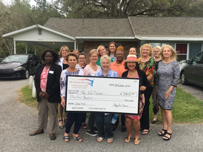 100+ Women Who Care Present The Life Center with a $5,400 donation.