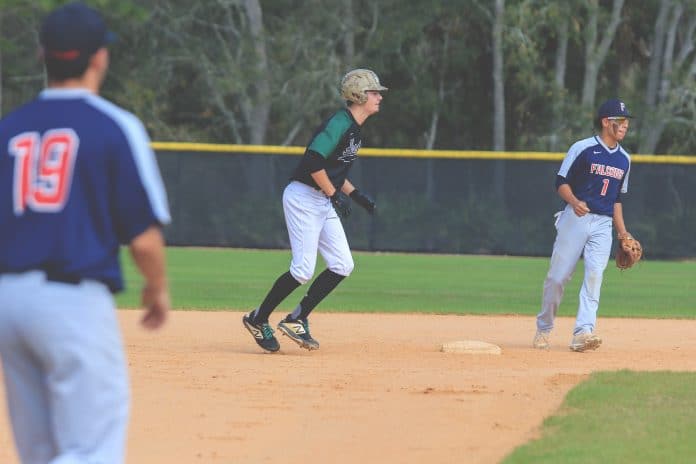 Collin Greer running towards the dugout during a game on March 20, 2019