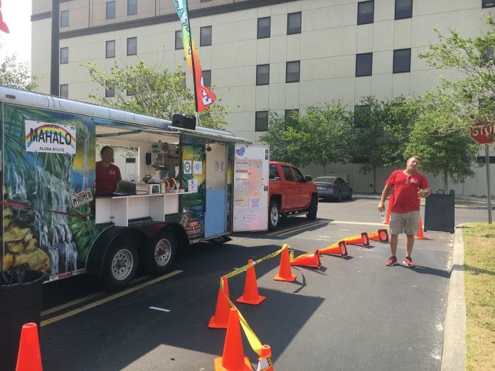 Aloha 808, Island Treats proprietors Cherise and Michael Romeo are stationed at the Oak Hill Hospital Parking lot to give out refreshing shaved ice treats to hospital staff on Monday April 13, 2020.