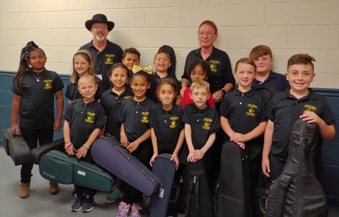 Chocachatti String Orchestra after performing at the school board  