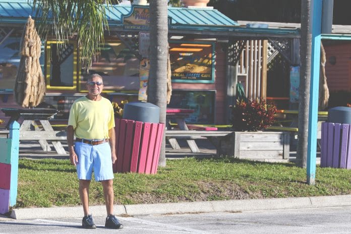 Willy Kochounian, the owner of Willy’s Tropical Breeze Cafe located in the Pine Island Park area, looks forward to visitors coming to the beach after weeks of closure.