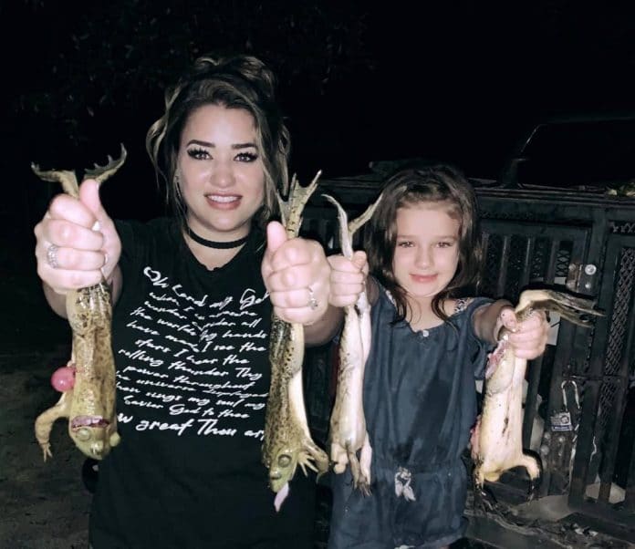 Toby's friends Rebecca and daughter, Janie Spradley with hands full of freshly caught croakers!