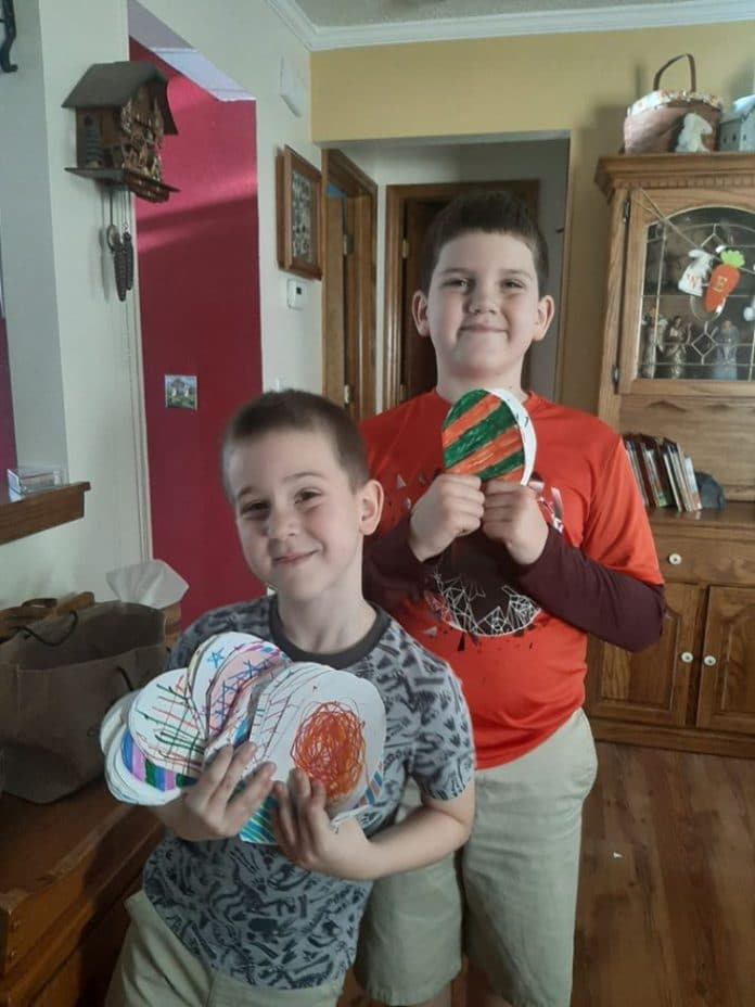 Scouts, William and Henry Thomas, with Easter cards they made for local elderly residents.  