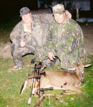 Toby and his dad, Buster and a buck his dad had arrowed near his home