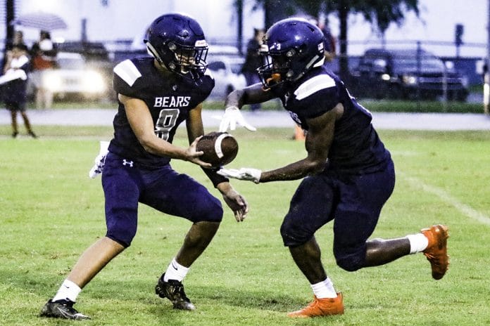 Central's Tre Joyner hands the ball off to Contae Cason