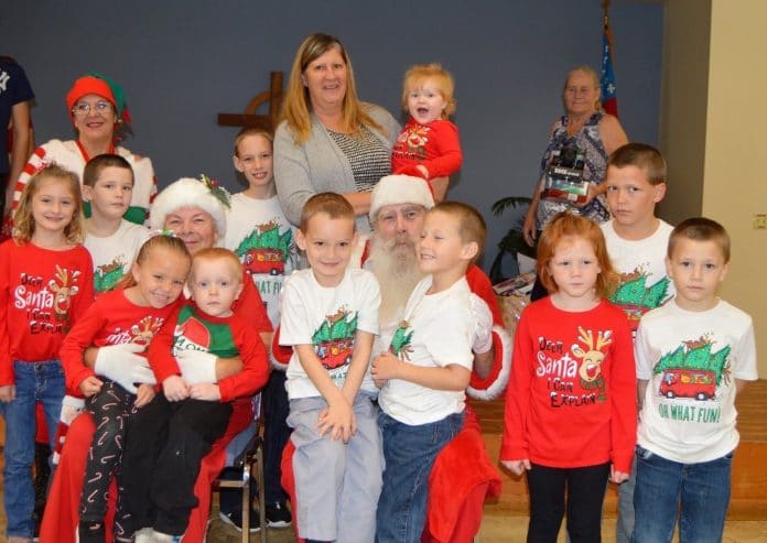 Connie Gordon holding Minnie (age 2), to her left - Kameron (age 10), Jamison (age 8), Kensie Mae (age 7), Aubree (age 4), Gabriel (age 3), Kayden & Kyle ( both age 6), Hope (age 5), Ivan (age 6), Kalija (age 9) 