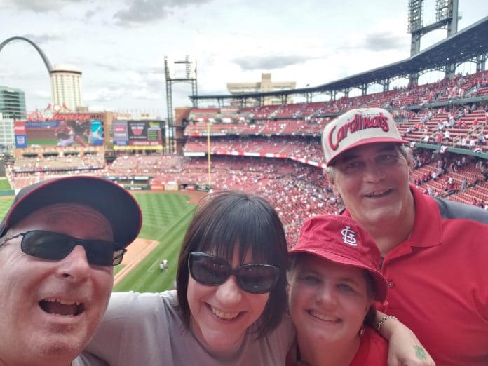 Busch Stadium, in St. Louis, taken at our seats in our favorite section of the park, up near the press box (of course), in August 2019, the last time we saw each other. The other people in the photo besides Mike and me are Cammie Ashline and Paul Weil, my brother and his partner, who often went to games with us during our St. Louis meetups. Mike took the photo.