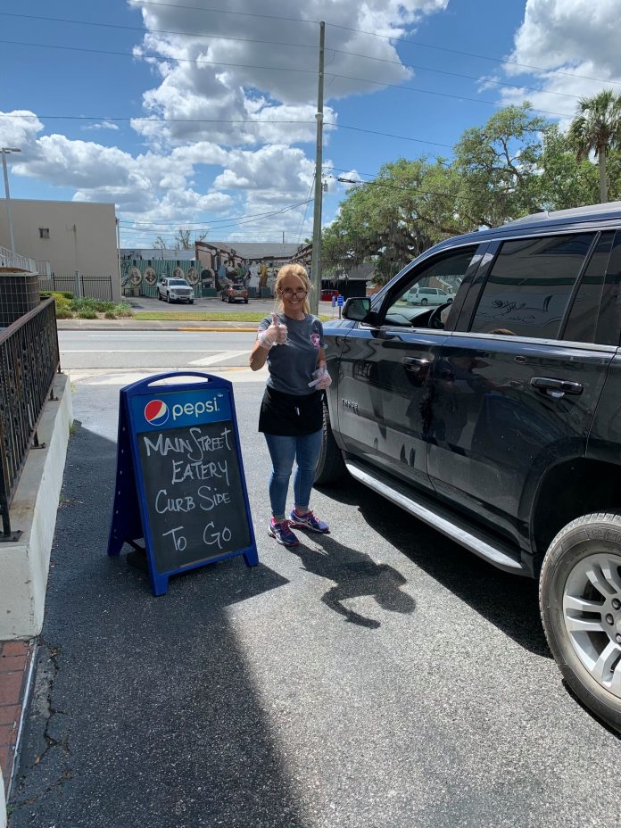 Peggy Bell and her truck at the Curbside to go lane of Main Street Eatery