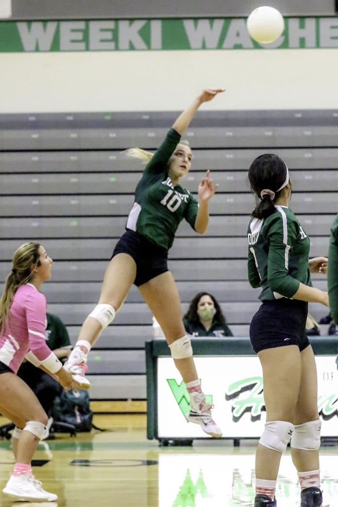 Thursday Night on the court at Weeki Wachee Oct 15, 2020. Weeki Wachee #10 Sr Alexandra Valtsiotis shoots a power punch to the Wildcats for the point.