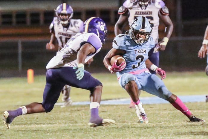  Hernando vs Nature Coast Friday night October 9, 2020 at NCT. Shark #3 Sr. Dedric Hall makes his move and gets past Leopard #5 Jr. Jordan Williams.  Photo by Cheryl Clanton. 