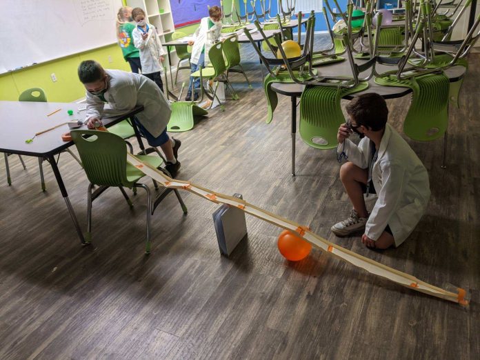 George Kistner and Giovanni Lombardo construct a track