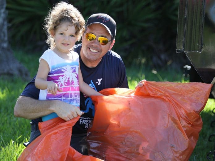In 2018, Rich Massa and his four-year old daughter Marley participated in the Coastal Cleanup at Linda Pedersen Park.  Photo by Alice Mary HerdenAnnual UF/IFAS Coastal Cleanup Goes Virtual