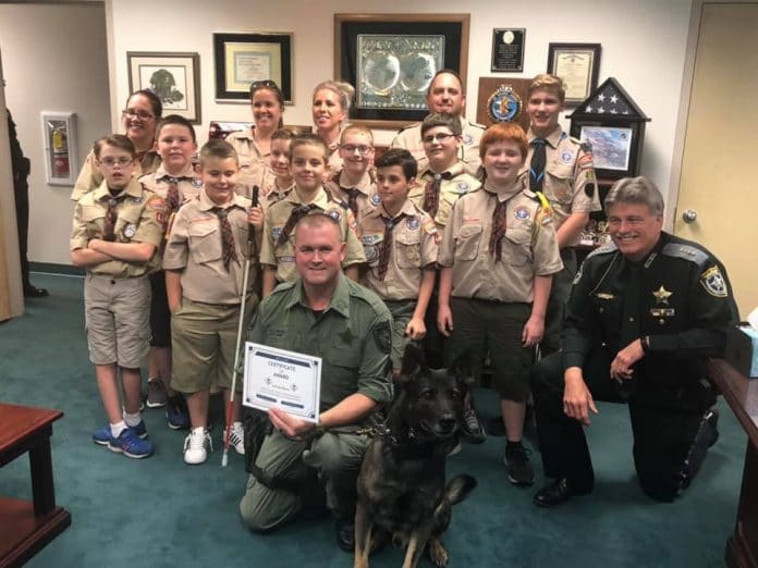Pack 443 stands for a photo after a very informative trip to the sheriff's office in 2019.