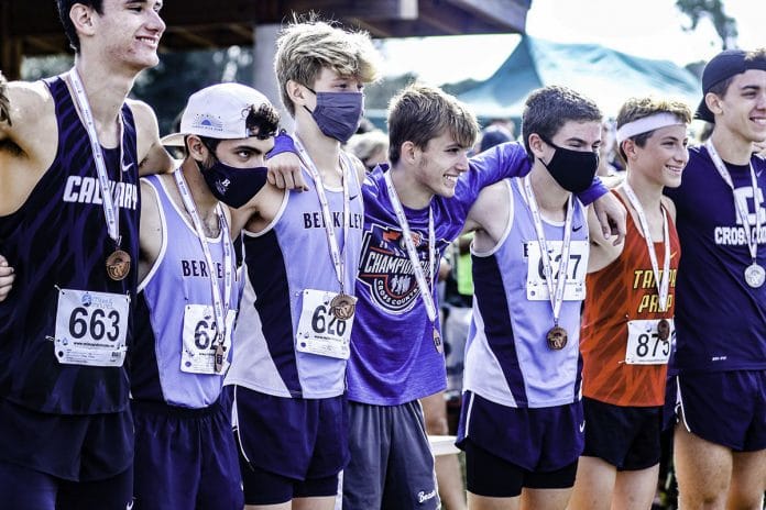 In the middle is John Carbone the only Hernando County Cross Country runner going to State.